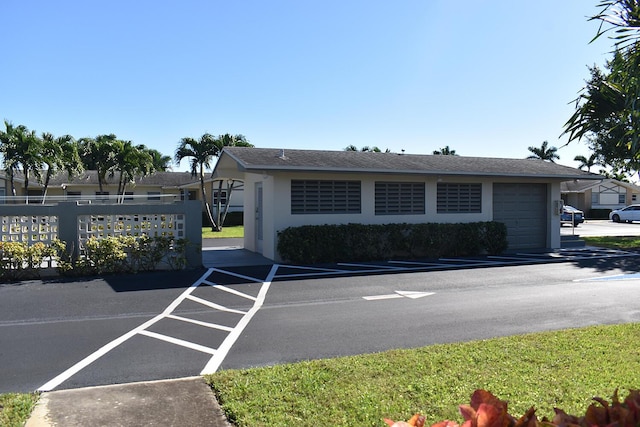 2597 Emory Dr W Unit G, West Palm Beach, FL 33415 - exterior space featuring an attached garage