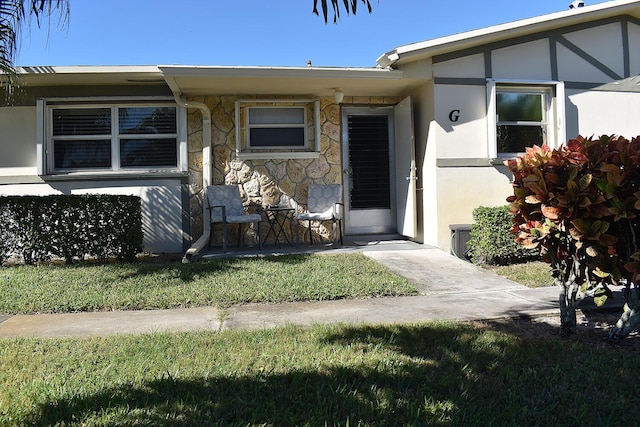 2597 Emory Dr W Unit G, West Palm Beach, FL 33415 - view of front of house with stucco siding and stone siding