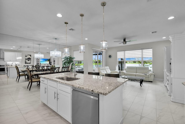 11454 SW Hawkins Ter, Port Saint Lucie, FL 34987 - kitchen with stainless steel appliances, light marble finish floors, ceiling fan, hanging light fixtures, and a kitchen island with sink