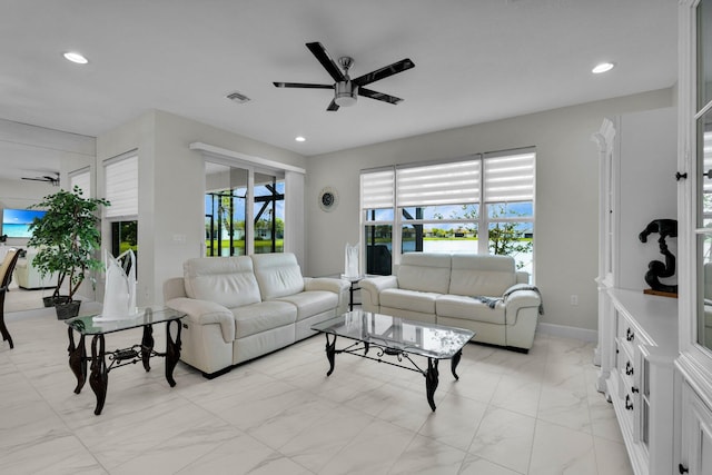 11454 SW Hawkins Ter, Port Saint Lucie, FL 34987 - living area featuring a ceiling fan, light marble finish flooring, healthy amount of natural light, and recessed lighting