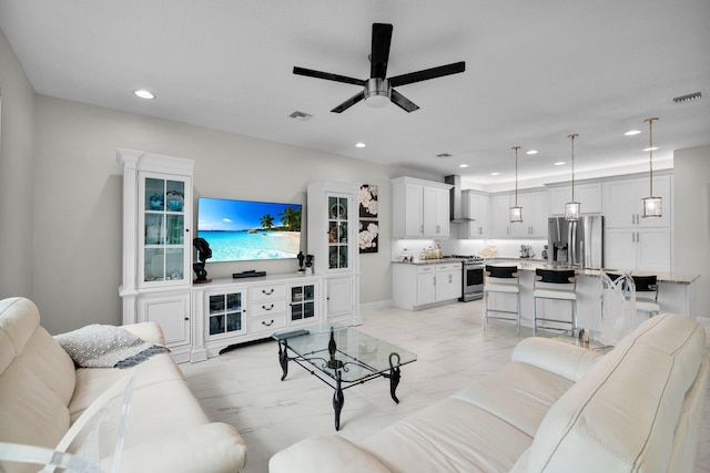 11454 SW Hawkins Ter, Port Saint Lucie, FL 34987 - living area featuring a ceiling fan, recessed lighting, and light marble finish floors