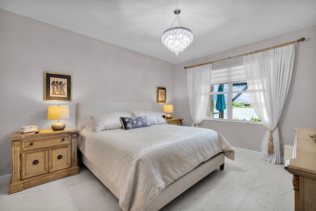 11454 SW Hawkins Ter, Port Saint Lucie, FL 34987 - bedroom with light marble finish floors and a chandelier