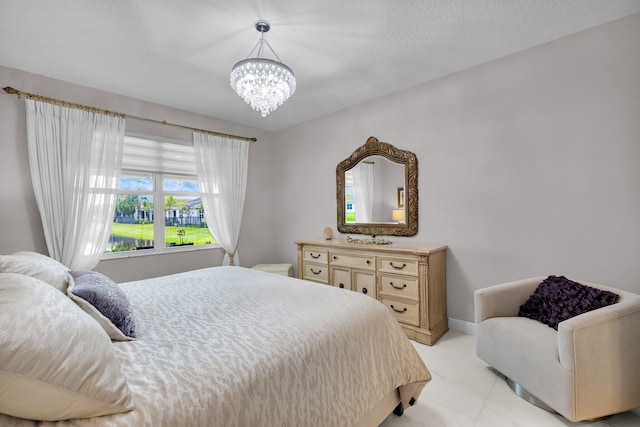 11454 SW Hawkins Ter, Port Saint Lucie, FL 34987 - bedroom featuring a chandelier and baseboards