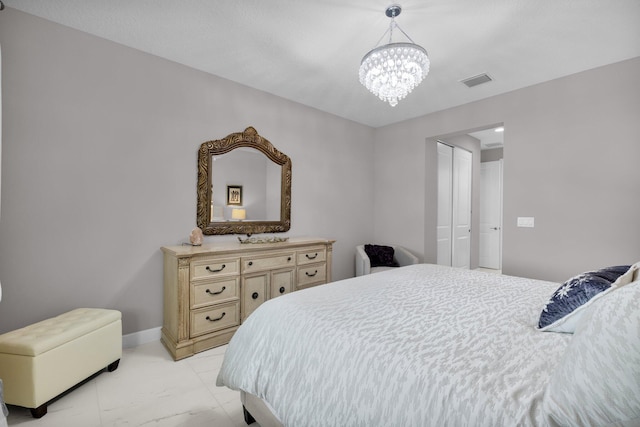 11454 SW Hawkins Ter, Port Saint Lucie, FL 34987 - bedroom with a chandelier, light marble finish flooring, and a closet
