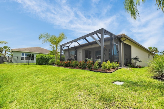 11454 SW Hawkins Ter, Port Saint Lucie, FL 34987 - back of house with stucco siding and a lanai