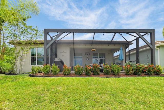 11454 SW Hawkins Ter, Port Saint Lucie, FL 34987 - rear view of property with stucco siding, a lawn, and glass enclosure