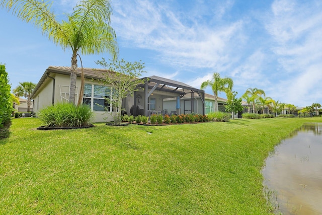 11454 SW Hawkins Ter, Port Saint Lucie, FL 34987 - view of front of home with stucco siding, a front lawn, a lanai, and a water view