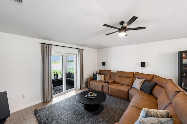 956 Bent Creek Dr, Fort Pierce, FL 34947 - living room with light wood finished floors, a ceiling fan, and baseboards