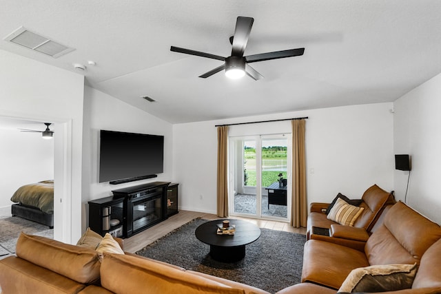 956 Bent Creek Dr, Fort Pierce, FL 34947 - living room featuring ceiling fan, lofted ceiling, and baseboards