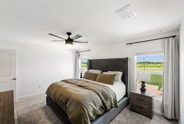 956 Bent Creek Dr, Fort Pierce, FL 34947 - bedroom with light carpet, baseboards, and a ceiling fan