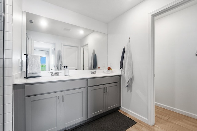 956 Bent Creek Dr, Fort Pierce, FL 34947 - full bathroom with wood finished floors, double vanity, baseboards, and recessed lighting