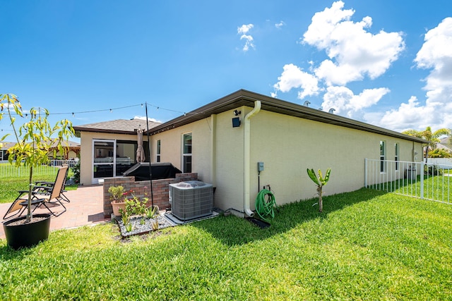 956 Bent Creek Dr, Fort Pierce, FL 34947 - rear view of house with central air condition unit, a patio area, and stucco siding