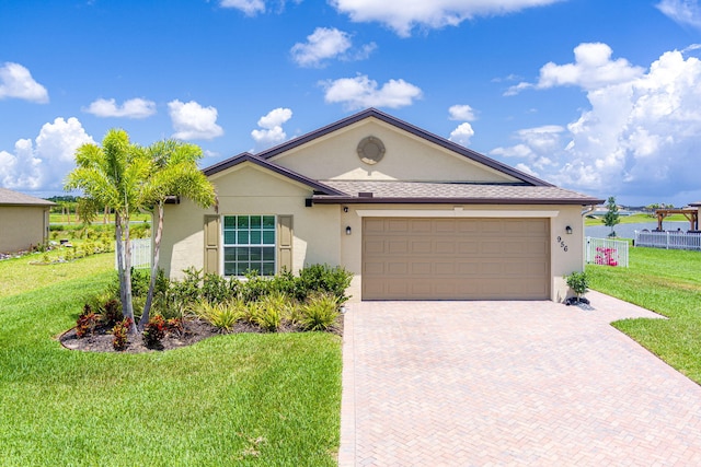 956 Bent Creek Dr, Fort Pierce, FL 34947 - ranch-style house with stucco siding, decorative driveway, and a garage