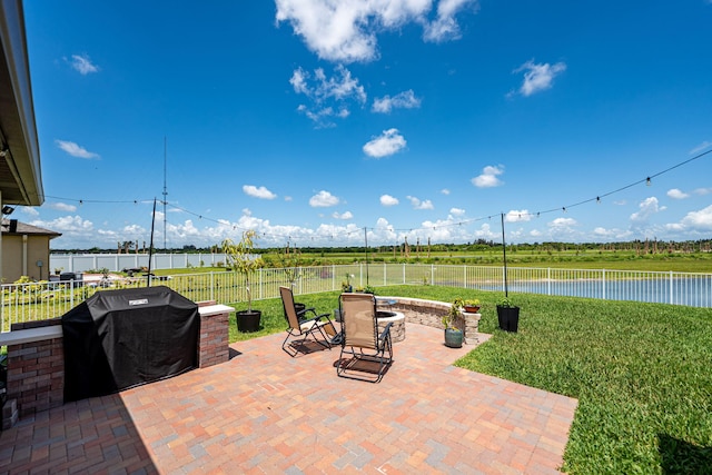 956 Bent Creek Dr, Fort Pierce, FL 34947 - view of patio with area for grilling and a water view
