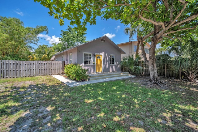 1005 SW 15th Ter, Fort Lauderdale, FL 33312 - view of front facade with stucco siding and a wooden deck