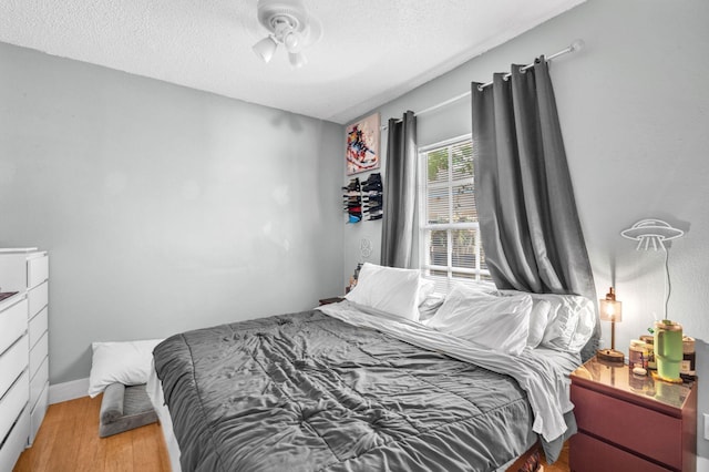 1005 SW 15th Ter, Fort Lauderdale, FL 33312 - bedroom featuring light wood-type flooring and a textured ceiling