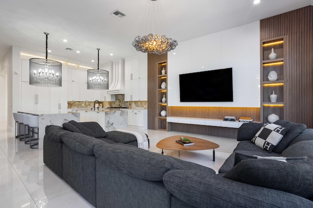 17725 Circle Pond Ct, Boca Raton, FL 33496 - living room with a chandelier, recessed lighting, built in features, and wood walls