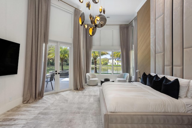 17725 Circle Pond Ct, Boca Raton, FL 33496 - bedroom with access to exterior, multiple windows, a chandelier, and french doors