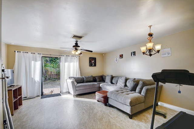 799 Hill Dr Unit F, West Palm Beach, FL 33415 - living room featuring a ceiling fan and a chandelier