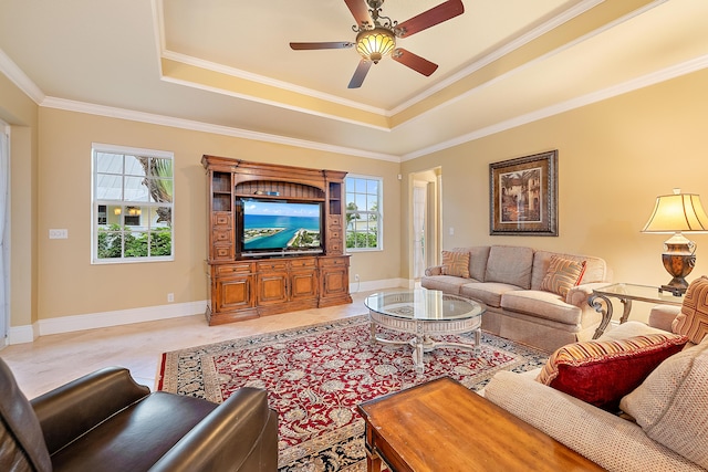 18974 SE Jupiter River Dr, Jupiter, FL 33458 - living area featuring a tray ceiling, plenty of natural light, a ceiling fan, crown molding, and baseboards