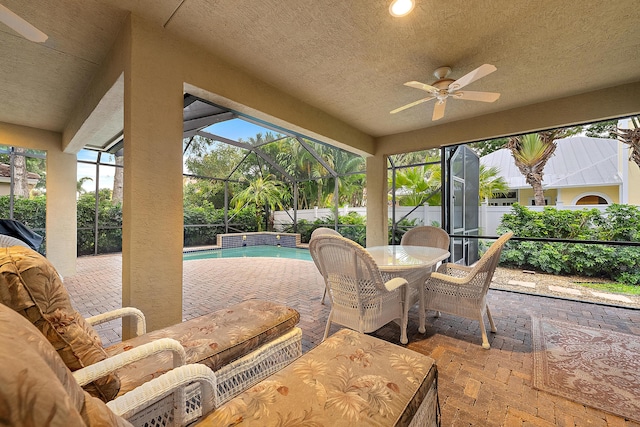 18974 SE Jupiter River Dr, Jupiter, FL 33458 - sunroom / solarium with a ceiling fan and outdoor dining area