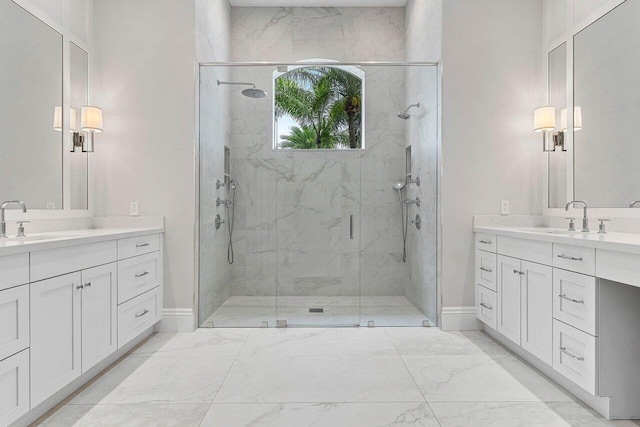 206 Via Emilia, Palm Beach Gardens, FL 33418 - bathroom with a marble finish shower, two vanities, baseboards, and marble finish flooring