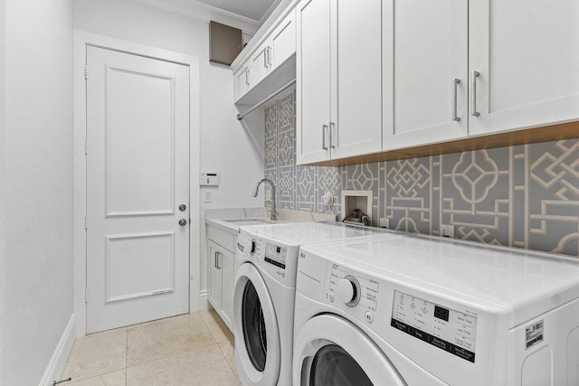 206 Via Emilia, Palm Beach Gardens, FL 33418 - washroom featuring washer and dryer, ornamental molding, cabinet space, light tile patterned floors, and baseboards