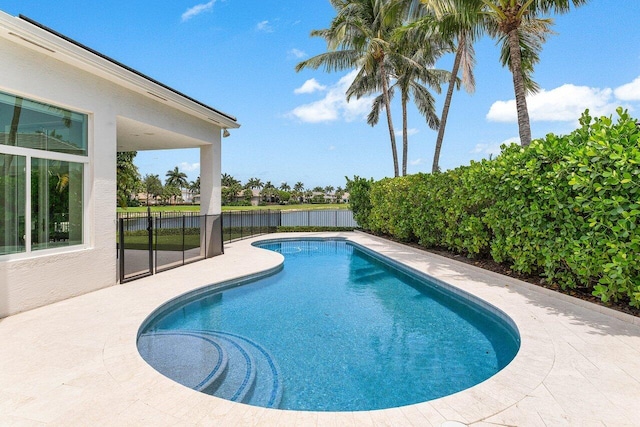 206 Via Emilia, Palm Beach Gardens, FL 33418 - view of pool featuring a fenced backyard, a water view, and a patio