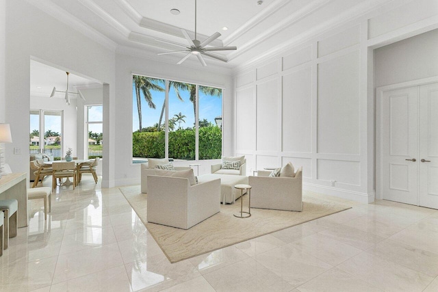 206 Via Emilia, Palm Beach Gardens, FL 33418 - living area featuring a decorative wall, ceiling fan, ornamental molding, a high ceiling, and recessed lighting