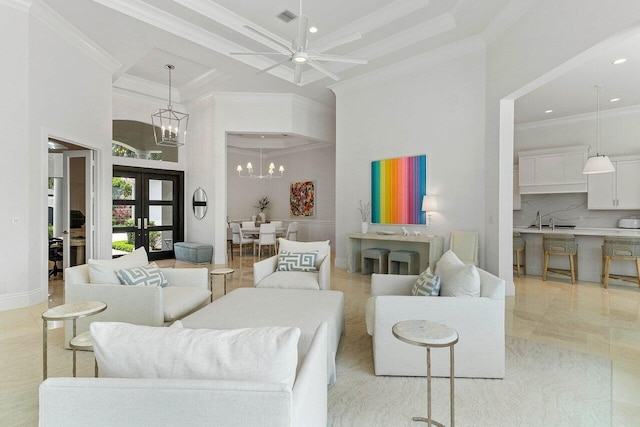 206 Via Emilia, Palm Beach Gardens, FL 33418 - living room with a towering ceiling, ornamental molding, a chandelier, recessed lighting, and ceiling fan