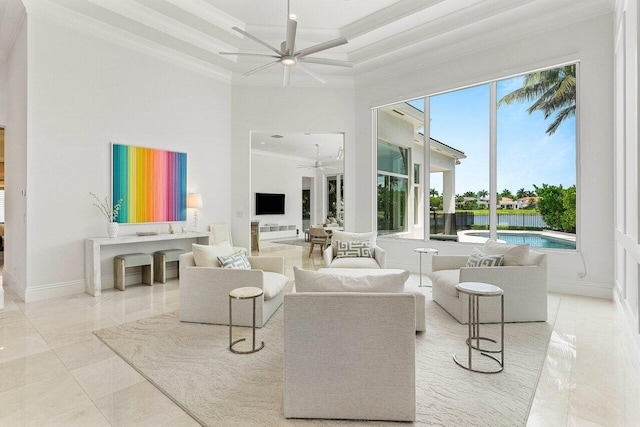 206 Via Emilia, Palm Beach Gardens, FL 33418 - living room with ceiling fan, healthy amount of natural light, ornamental molding, baseboards, and a towering ceiling