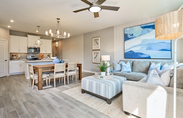 7472 Lenora Ln, Lake Worth, FL 33467 - living area featuring ceiling fan, baseboards, a chandelier, light wood finished floors, and recessed lighting