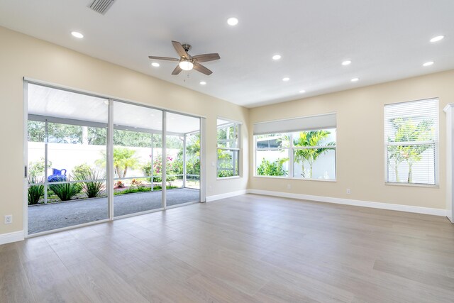 2925 SW Brighton Way, Palm City, FL 34990 - empty room featuring a ceiling fan, recessed lighting, and wood finished floors