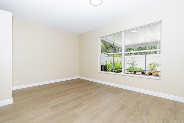 2925 SW Brighton Way, Palm City, FL 34990 - spare room with light wood-type flooring and baseboards