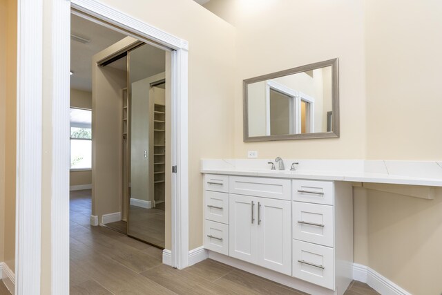 2925 SW Brighton Way, Palm City, FL 34990 - full bath featuring a marble finish shower, vanity, and wood finished floors