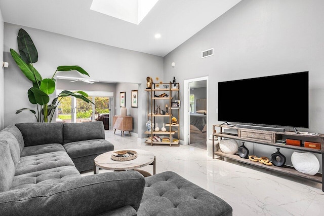 7572 Island Breeze Ter, Boynton Beach, FL 33437 - living room with marble tiled floors, high vaulted ceiling, a skylight, and recessed lighting