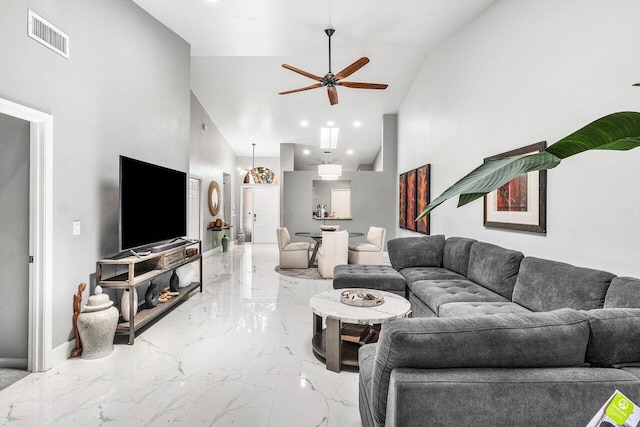 7572 Island Breeze Ter, Boynton Beach, FL 33437 - living room with marble tiled flooring, ceiling fan, high vaulted ceiling, and baseboards