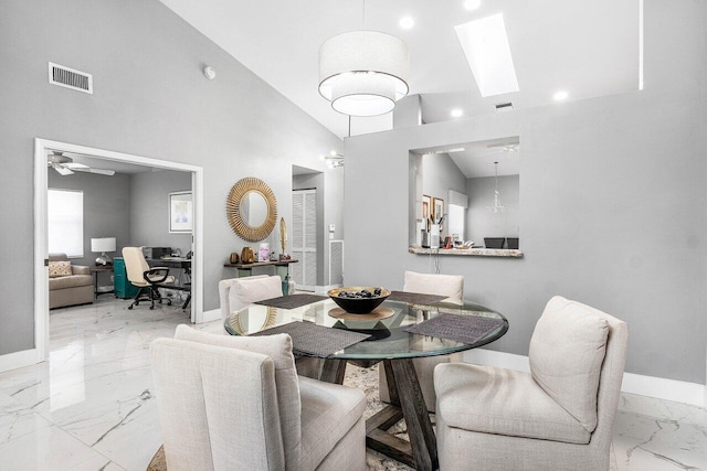 7572 Island Breeze Ter, Boynton Beach, FL 33437 - dining space featuring marble finish floors, baseboards, an office area, a skylight, and ceiling fan
