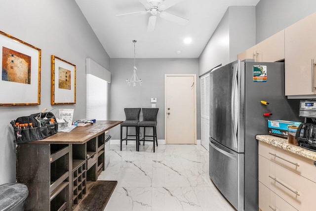 7572 Island Breeze Ter, Boynton Beach, FL 33437 - kitchen with freestanding refrigerator, lofted ceiling, light marble finish flooring, ceiling fan, and a chandelier