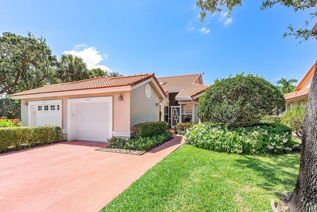 7572 Island Breeze Ter, Boynton Beach, FL 33437 - mediterranean / spanish-style home featuring a tile roof, stucco siding, driveway, a front yard, and an attached garage