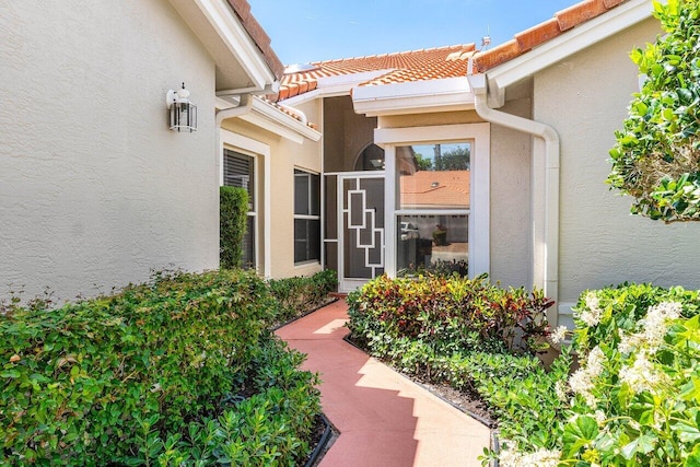 7572 Island Breeze Ter, Boynton Beach, FL 33437 - entrance to property featuring stucco siding and a tile roof