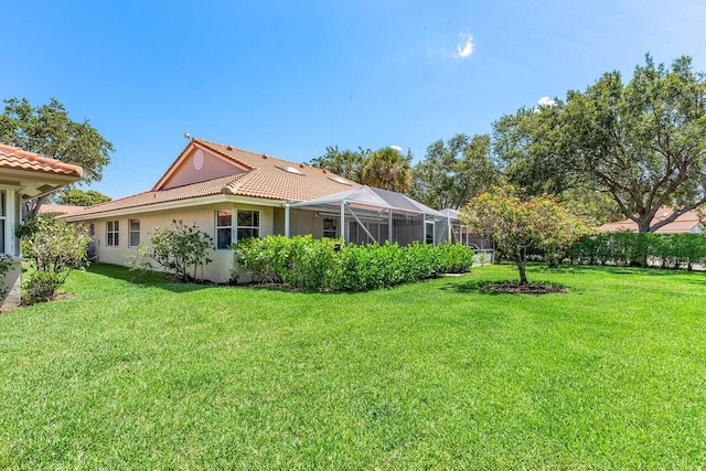 7572 Island Breeze Ter, Boynton Beach, FL 33437 - view of green lawn featuring a lanai