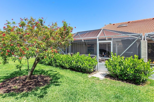 7572 Island Breeze Ter, Boynton Beach, FL 33437 - back of house featuring a lawn and a lanai
