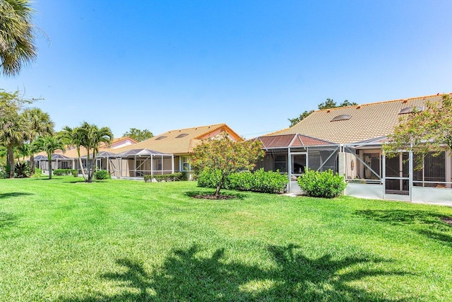 7572 Island Breeze Ter, Boynton Beach, FL 33437 - view of green lawn with glass enclosure
