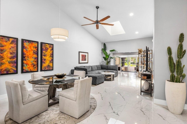7572 Island Breeze Ter, Boynton Beach, FL 33437 - living room with high vaulted ceiling, marble tiled flooring, a skylight, ceiling fan, and baseboards