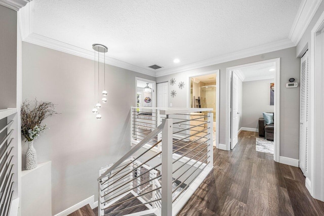9961 Marsala Way, Delray Beach, FL 33446 - corridor with an upstairs landing, dark wood-style flooring, a textured ceiling, baseboards, and crown molding