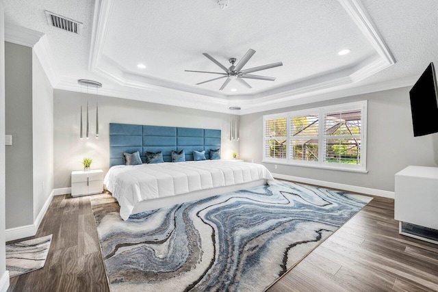9961 Marsala Way, Delray Beach, FL 33446 - bedroom with a tray ceiling, a textured ceiling, ornamental molding, wood finished floors, and baseboards