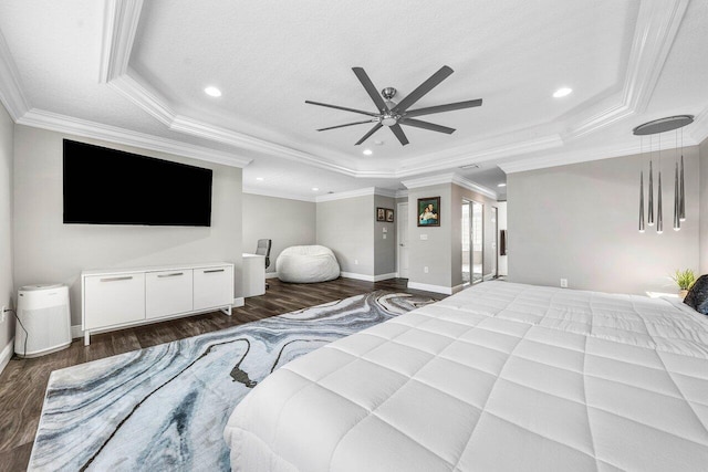 9961 Marsala Way, Delray Beach, FL 33446 - bedroom featuring a raised ceiling, dark wood-type flooring, baseboards, crown molding, and recessed lighting