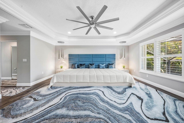 9961 Marsala Way, Delray Beach, FL 33446 - bedroom with wood finished floors, crown molding, a raised ceiling, baseboards, and a textured ceiling