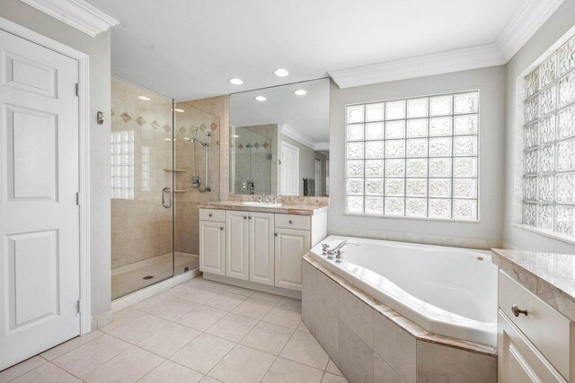 9961 Marsala Way, Delray Beach, FL 33446 - full bath featuring crown molding, vanity, a garden tub, a stall shower, and tile patterned flooring